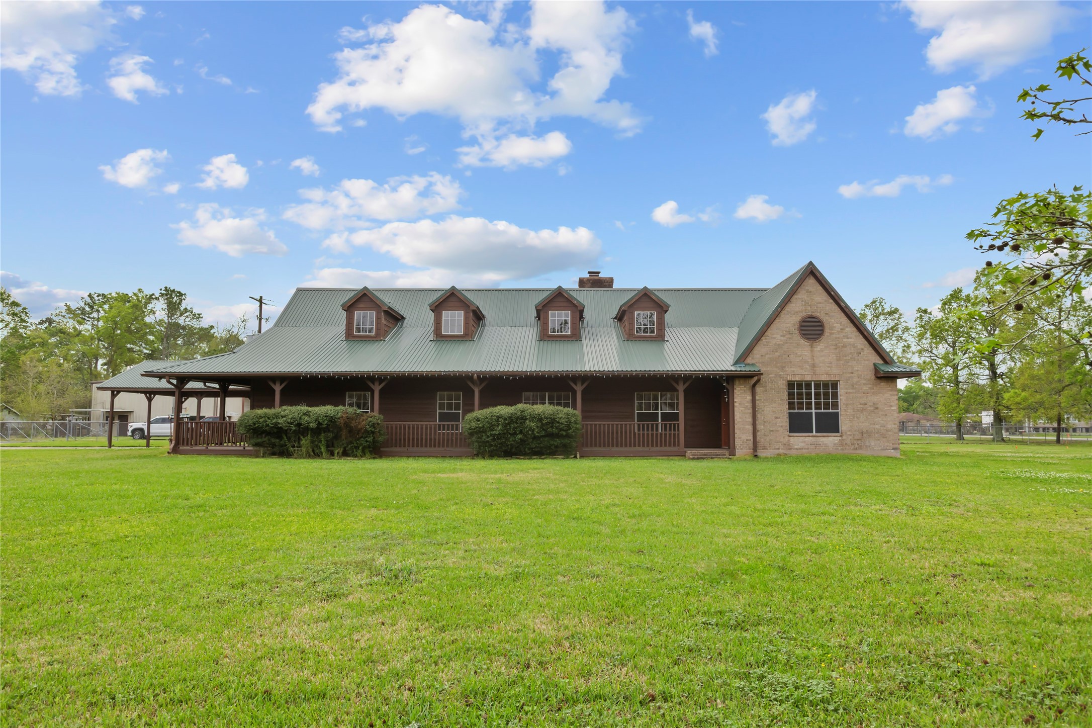 22916 East Martin Drive Porter, TX 77365 - Photo 1 of 43 a view of a house with a yard and roof