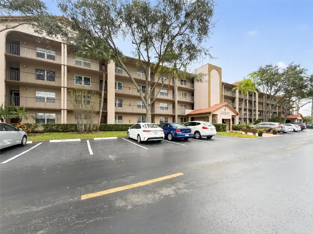 a view of a street with cars