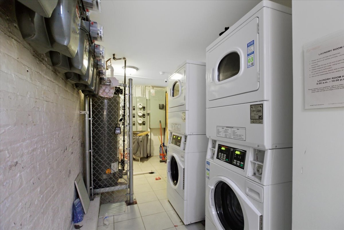 4423 South Prairie Avenue, Unit GARDEN Chicago, IL 60653 - Photo 12 of 13 a view of walk in closet with clothes and shoes