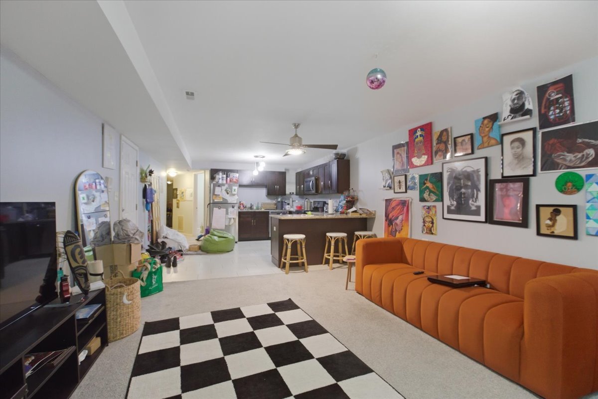 4423 South Prairie Avenue, Unit GARDEN Chicago, IL 60653 - Photo 5 of 13 a living room with furniture and a flat screen tv