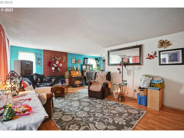 a bedroom with a bed a large window and walk in closet