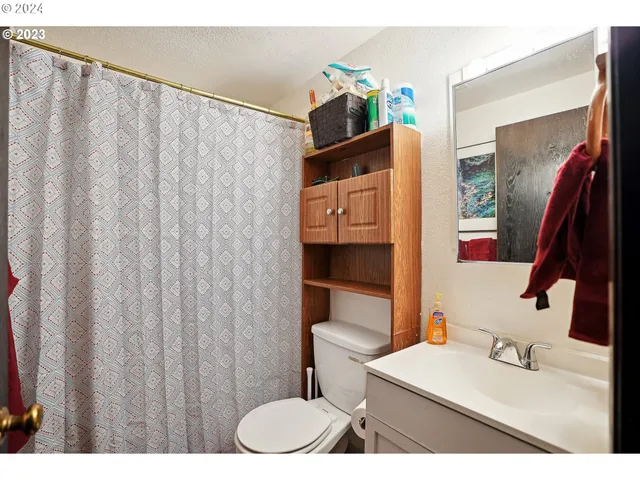 a kitchen with a refrigerator and a sink