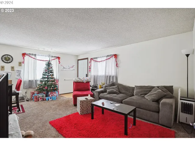 a kitchen with a sink cabinets and wooden floor