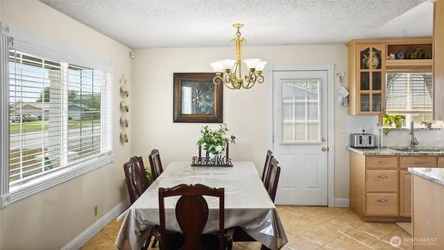 a view of a dining room with furniture window and outside view