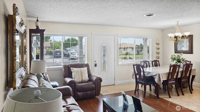 a view of a dining room with furniture window and outside view