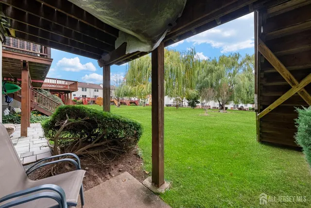 a view of yard with patio