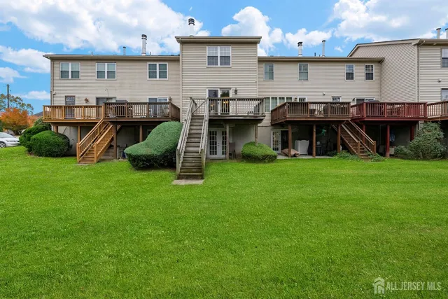 a front view of house with yard and outdoor seating