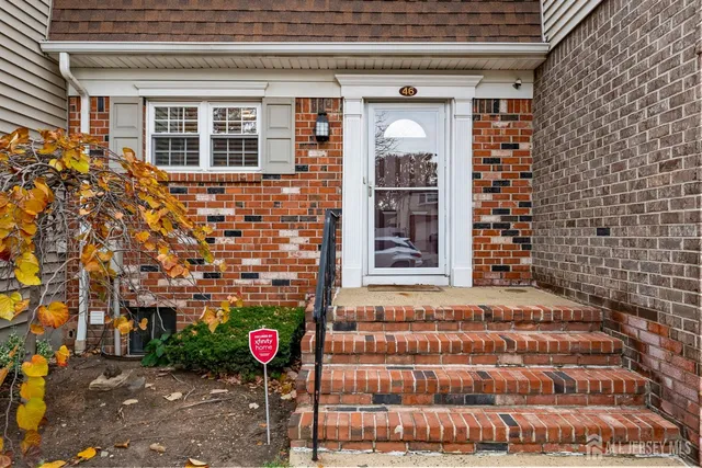 a view of a brick building with many windows