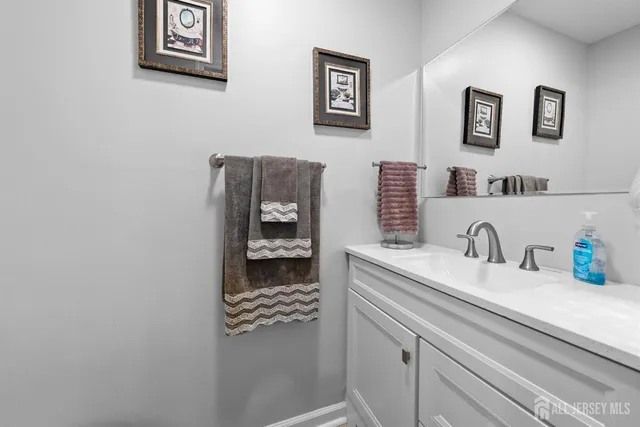 a kitchen with sink and cabinets