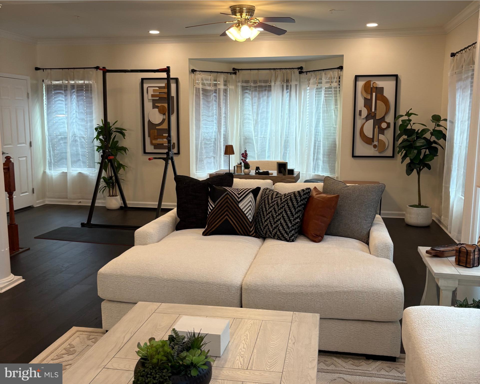 15145 Leicestershire Street Woodbridge, VA 22191 - Photo 13 of 19 a bedroom with a bed and a chandelier