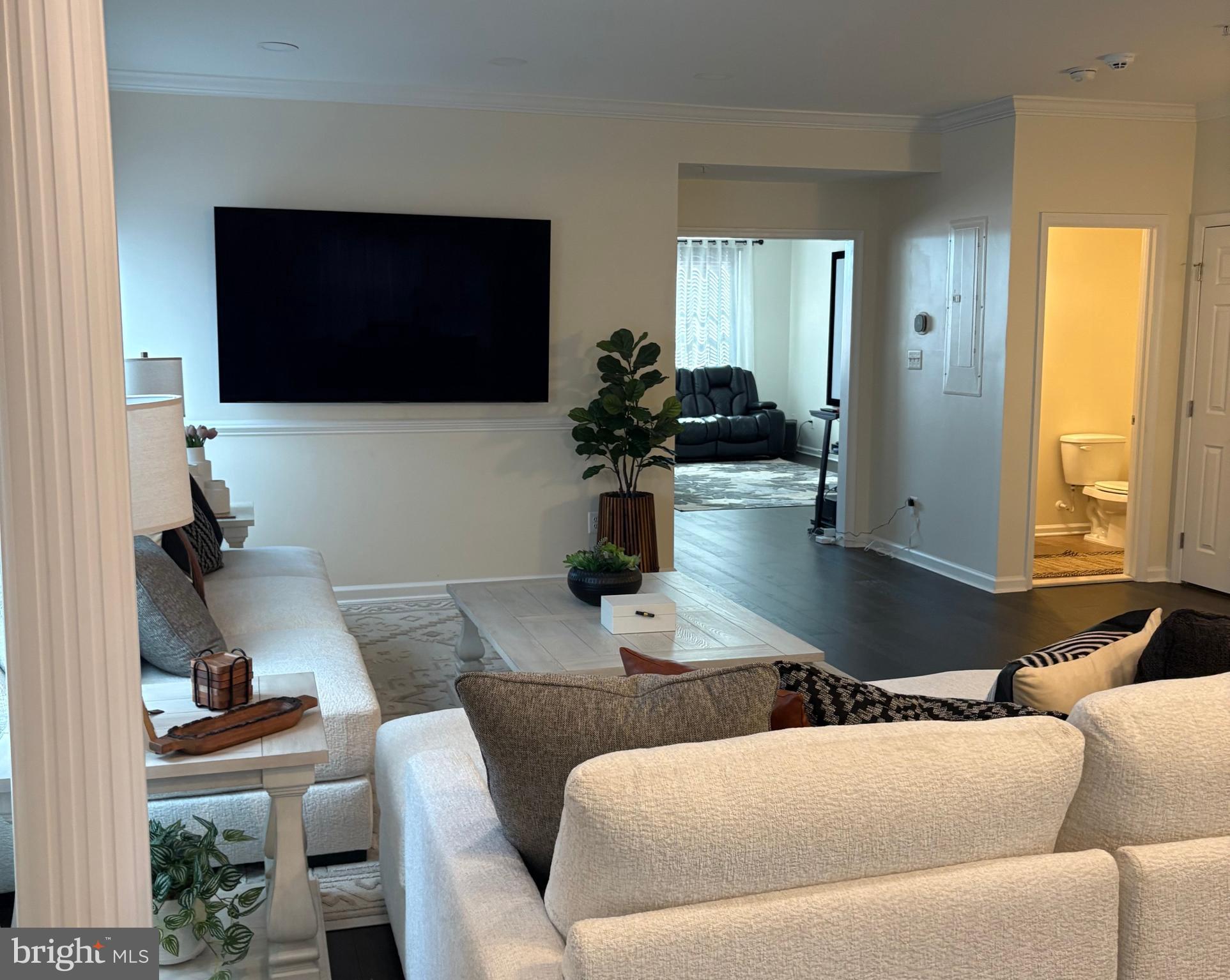15145 Leicestershire Street Woodbridge, VA 22191 - Photo 14 of 19 a living room with furniture and a flat screen tv
