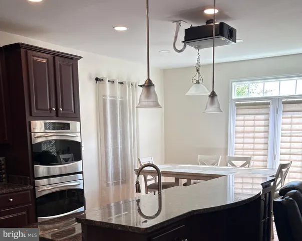 a kitchen with a sink a stove and refrigerator