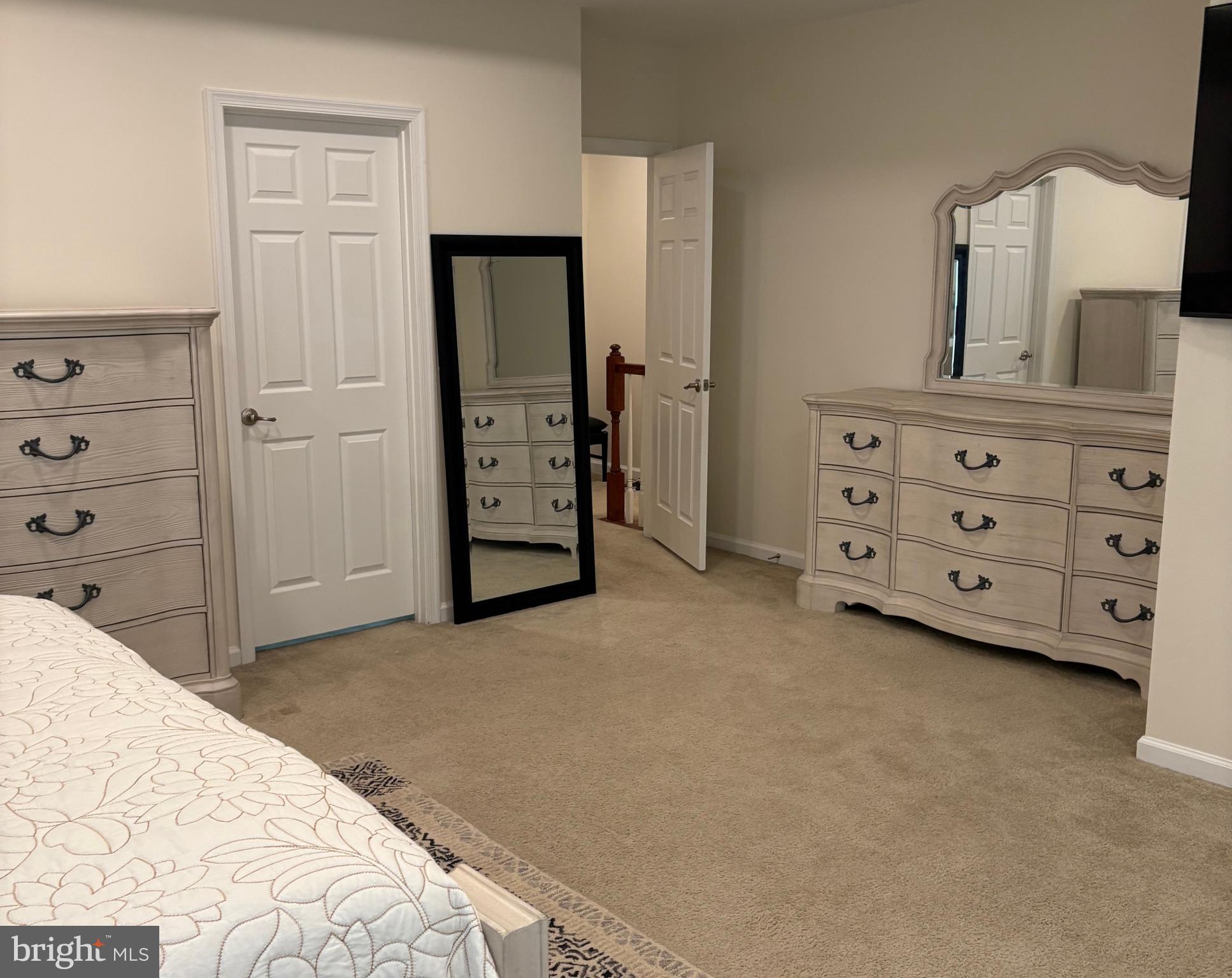 15145 Leicestershire Street Woodbridge, VA 22191 - Photo 6 of 19 a bedroom with a bed and a dresser