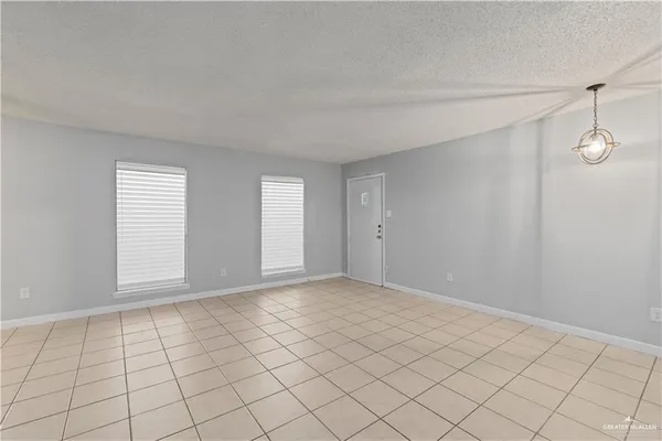 a view of an empty room and window