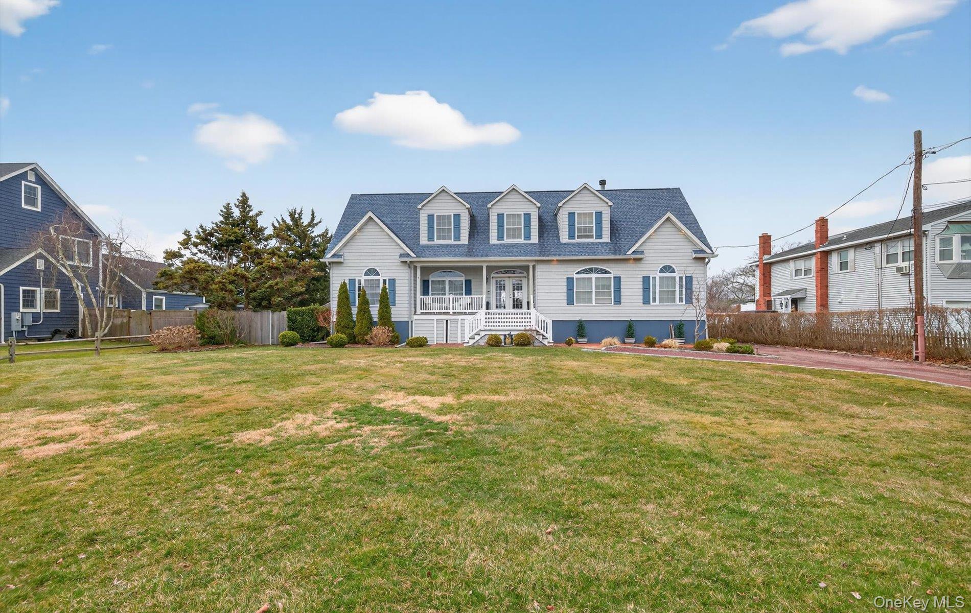108 Awixa Avenue Bay Shore, NY 11706 - Photo 2 of 50 a house view with a swimming pool