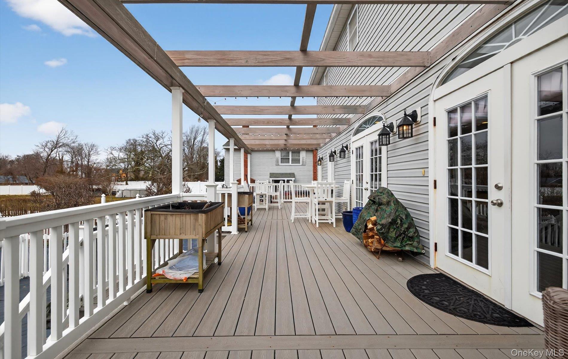 108 Awixa Avenue Bay Shore, NY 11706 - Photo 33 of 47 Deck with french doors and outdoor dining area