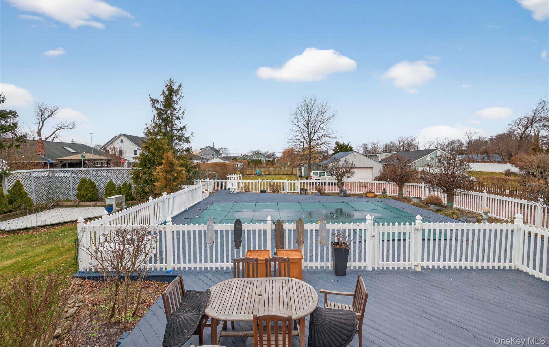 108 Awixa Avenue Bay Shore, NY 11706 - Photo 34 of 47 View of pool featuring a residential view, outdoor dining space, and a wooden deck