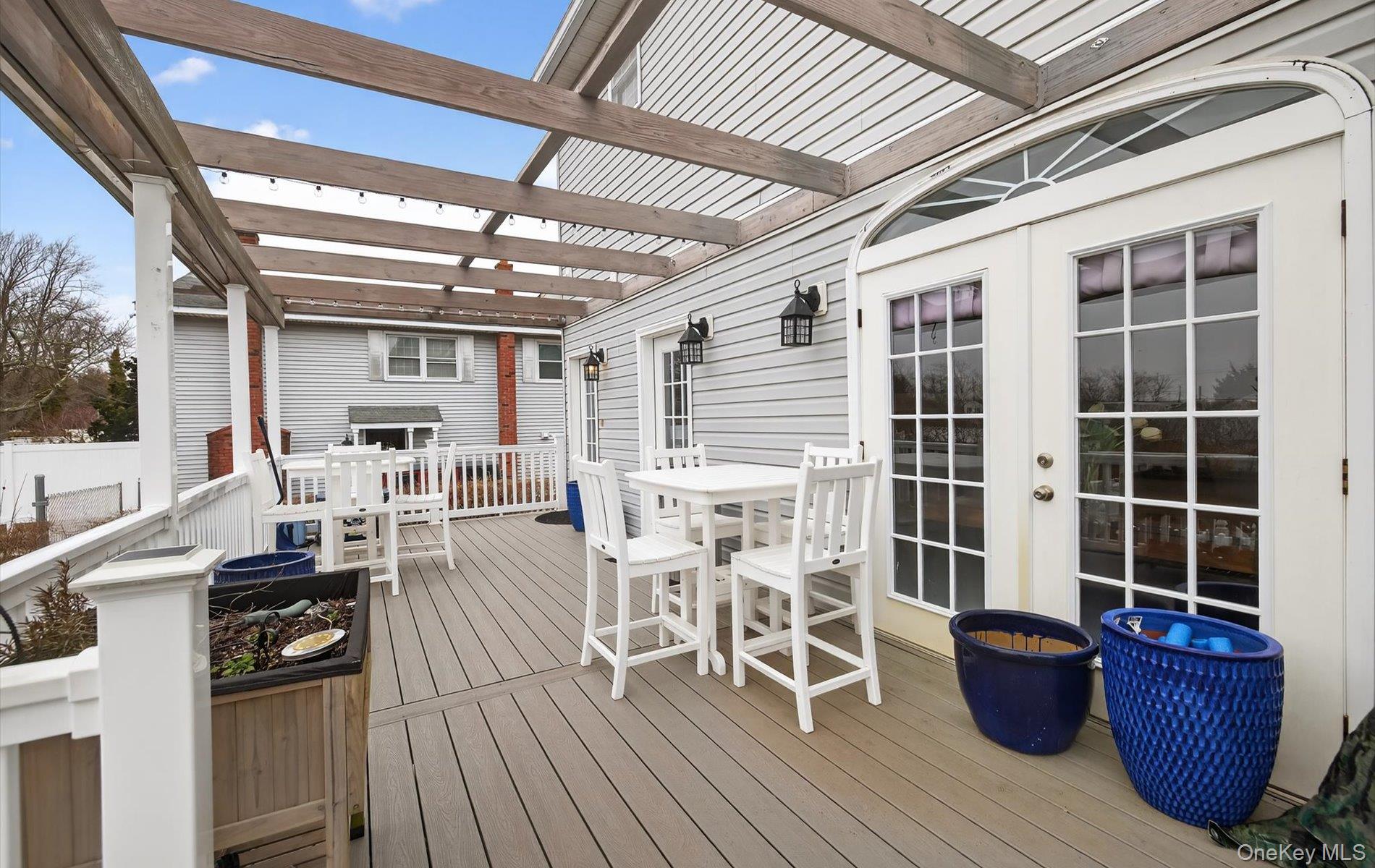 108 Awixa Avenue Bay Shore, NY 11706 - Photo 35 of 47 Wooden terrace featuring outdoor dining area and french doors