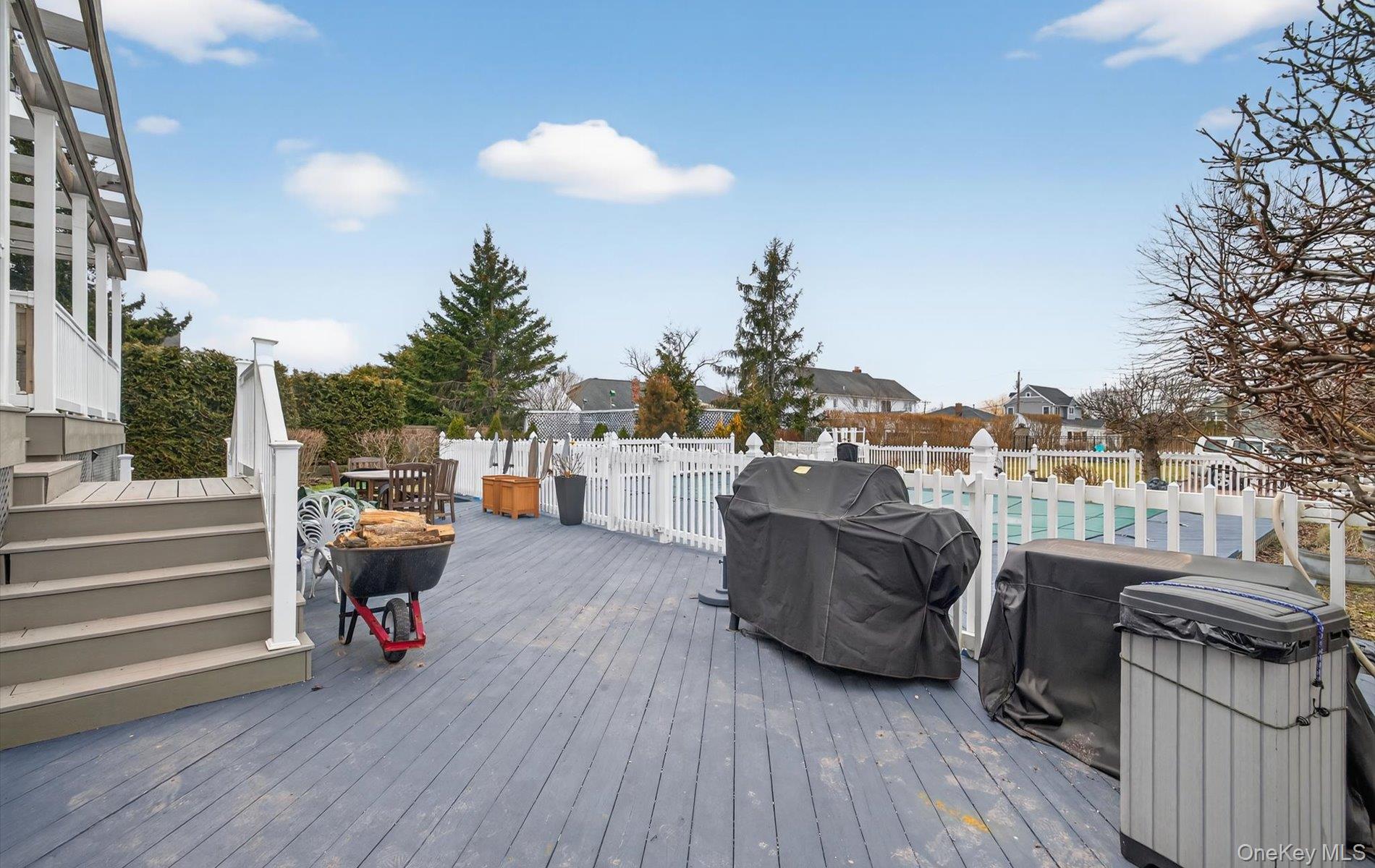 108 Awixa Avenue Bay Shore, NY 11706 - Photo 41 of 50 a view of a roof deck with couches and potted plants