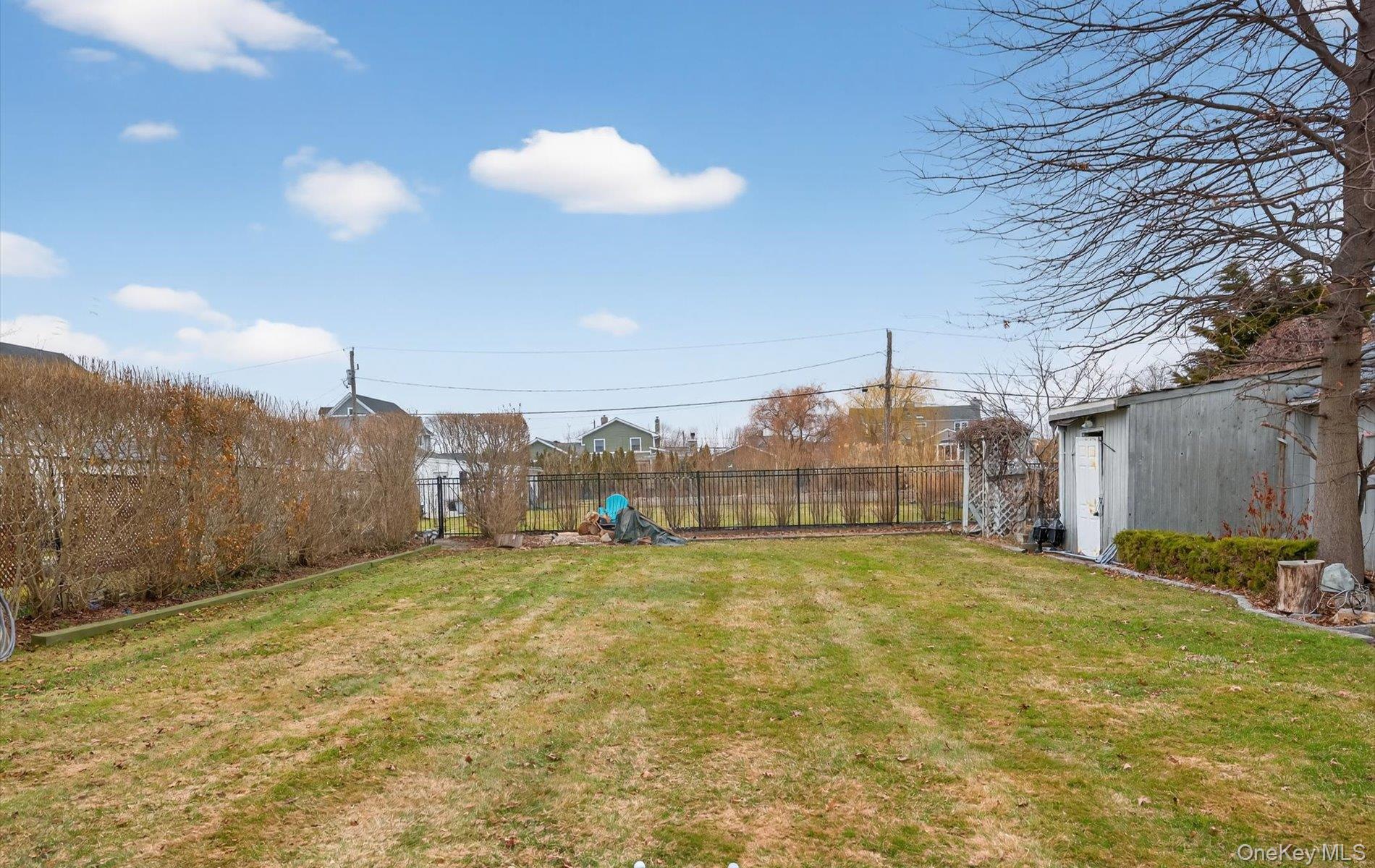 108 Awixa Avenue Bay Shore, NY 11706 - Photo 42 of 47 View of fenced backyard