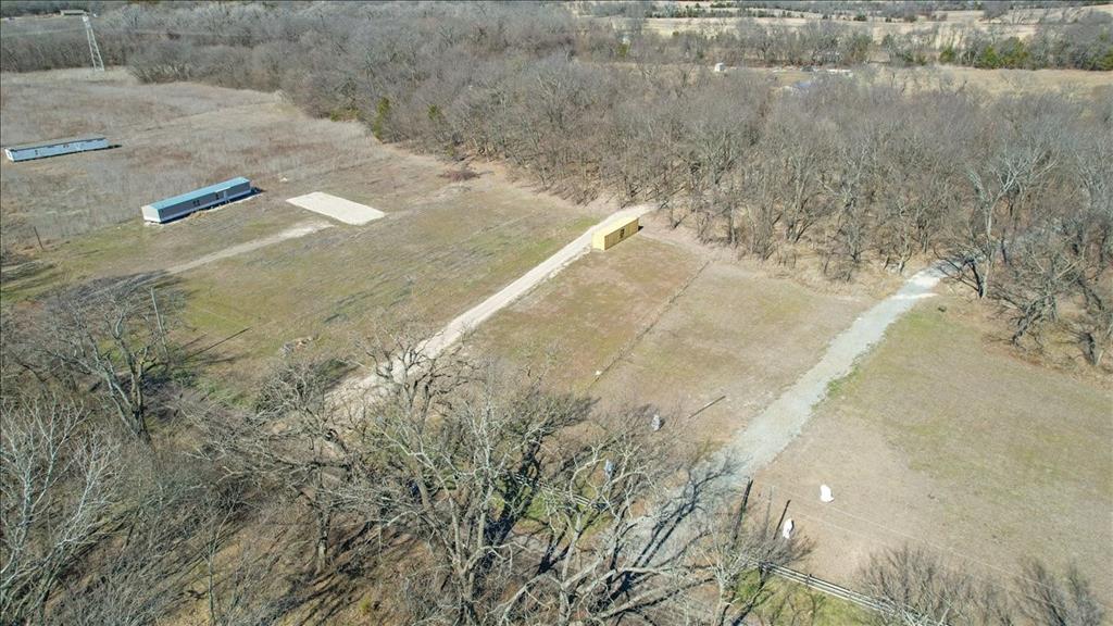 2 Gray Bottom Road Whitewright, TX 75491 - Photo 15 of 15 a view of a dry yard with trees