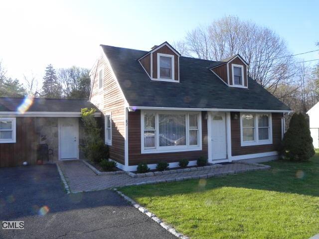 82 Old Barn Road South Stamford, CT 06905 - Photo 1 of 1 a front view of house with yard and trees in the background