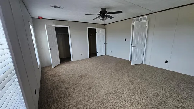 a view of empty room with windows