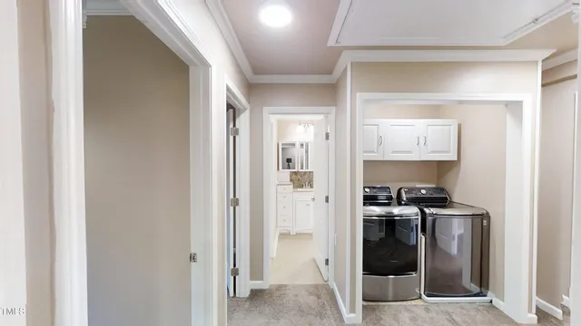 a view of a hallway with a refrigerator