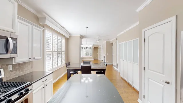 a view of living room with furniture and a large window