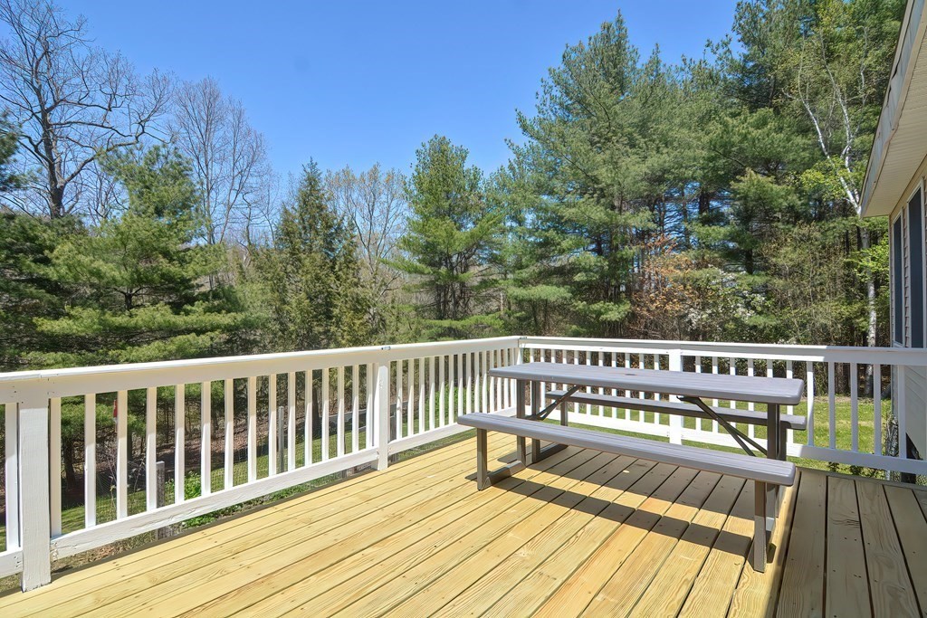 71 Lancaster Road Shirley, MA 01464 - Photo 29 of 34 a view of balcony with wooden floor and fence