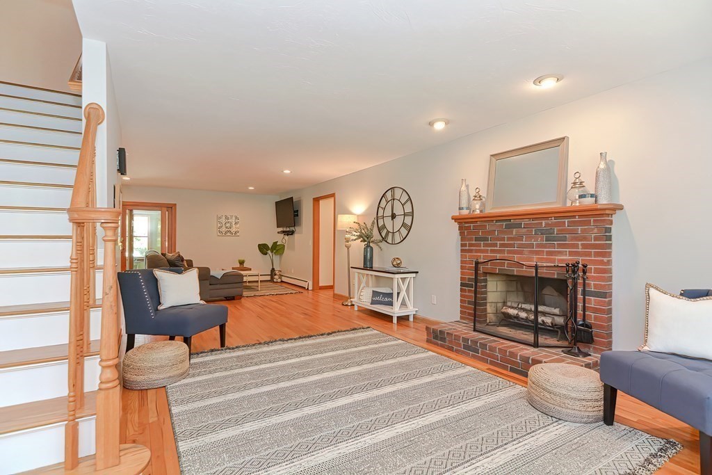 71 Lancaster Road Shirley, MA 01464 - Photo 7 of 34 a living room with furniture and a fireplace