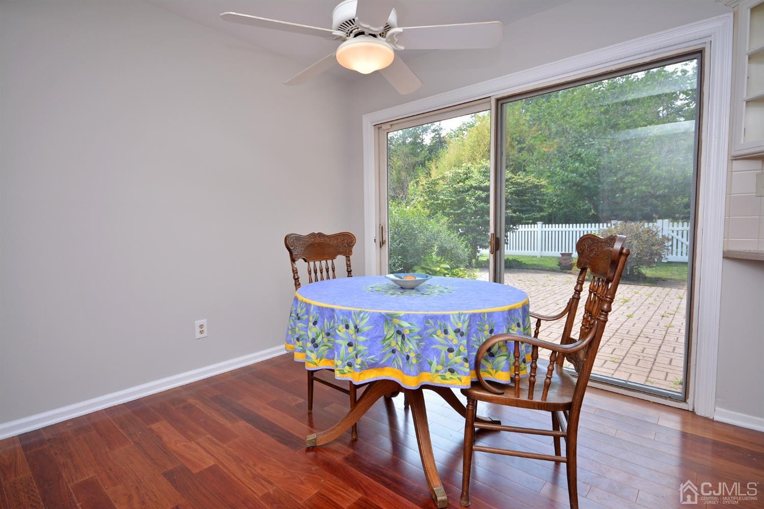 44 Johnson Road Somerset, NJ 08873 - Photo 8 of 27 a dining room with furniture a large window and wooden floor