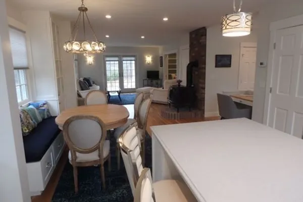 a large kitchen with a table and chairs