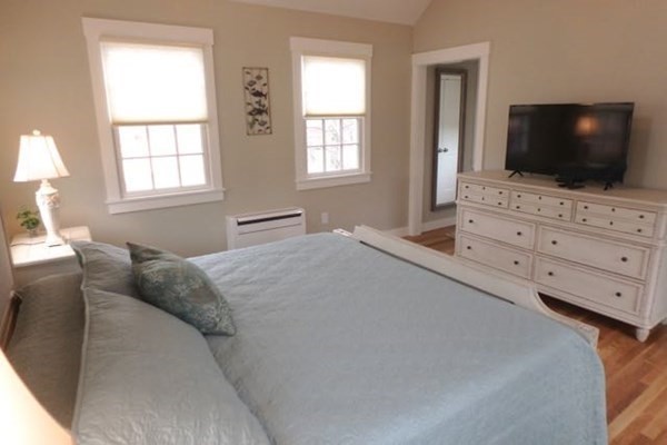 2 Strikers Way Chilmark, MA 02535 - Photo 16 of 33 a bedroom with a flat screen tv and a bed