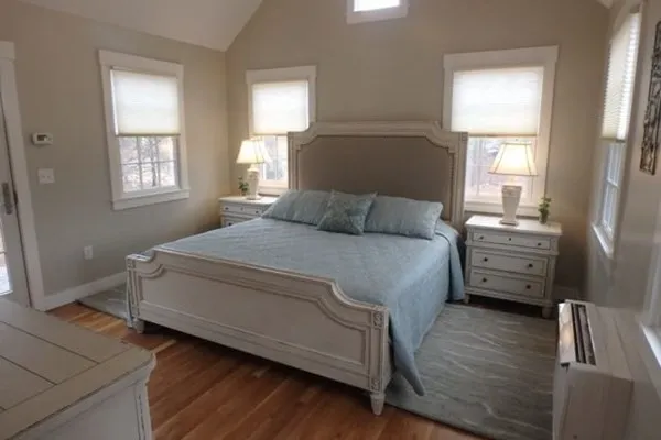a bedroom with a bed and a dresser