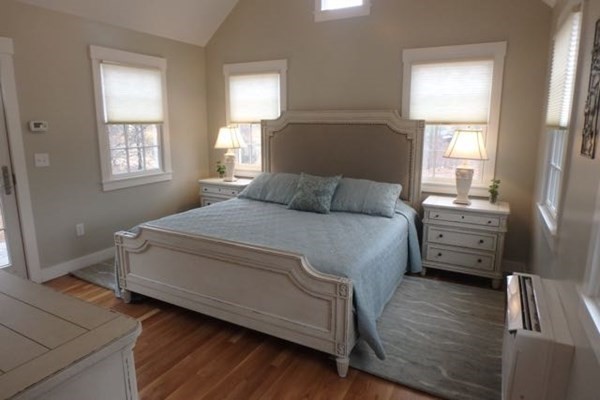 2 Strikers Way Chilmark, MA 02535 - Photo 17 of 33 a bedroom with a bed and a dresser
