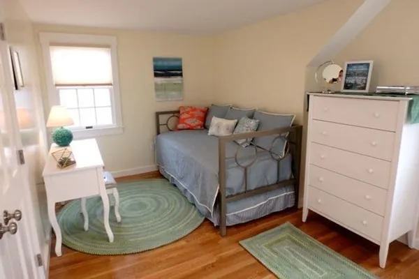 a bed room with a bed and a window