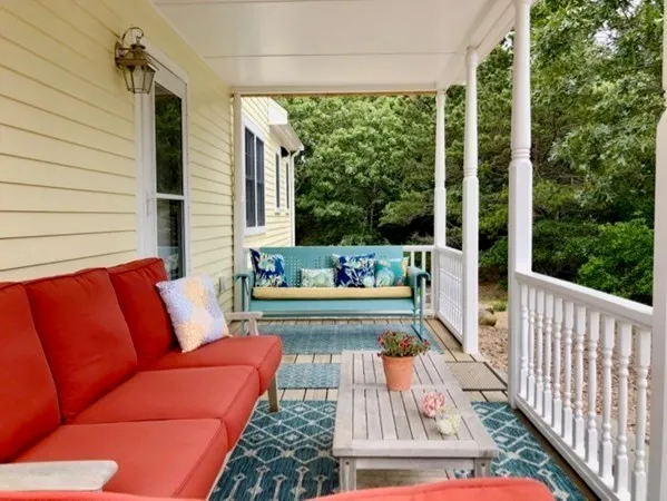 a view of a two chairs in the porch