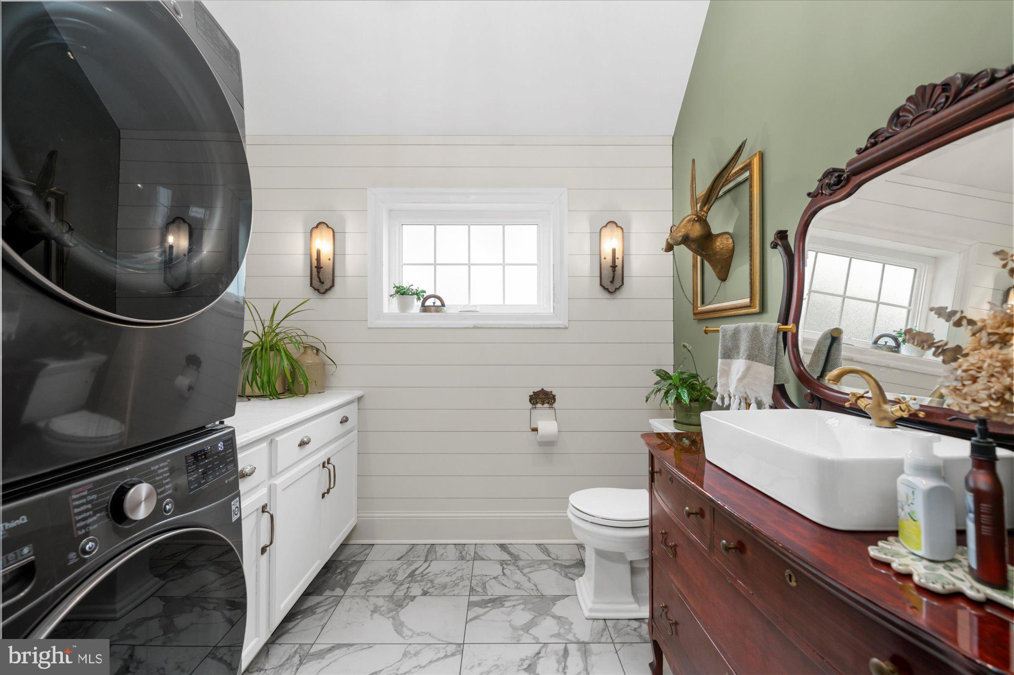 10 North Concord Road West Chester, PA 19382 - Photo 12 of 60 a bathroom with a granite countertop toilet sink and mirror