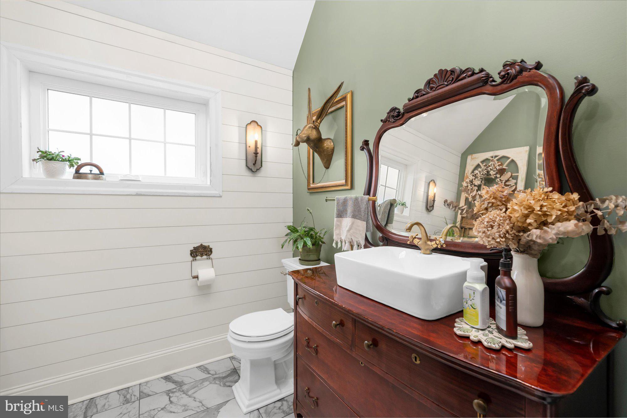 10 North Concord Road West Chester, PA 19382 - Photo 13 of 60 a bathroom with a toilet sink and mirror