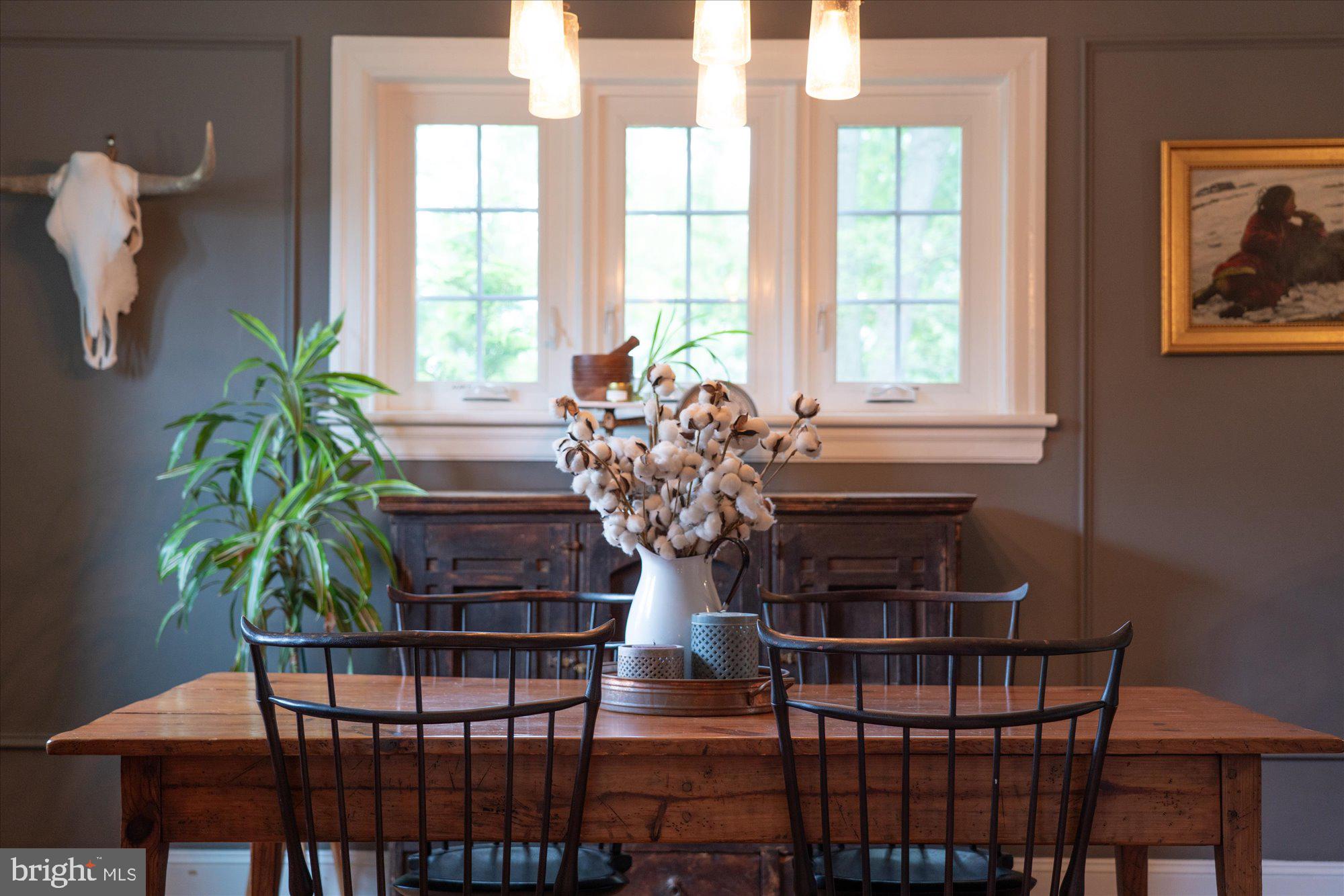 10 North Concord Road West Chester, PA 19382 - Photo 19 of 60 a vase of flowers sitting on a table with chairs