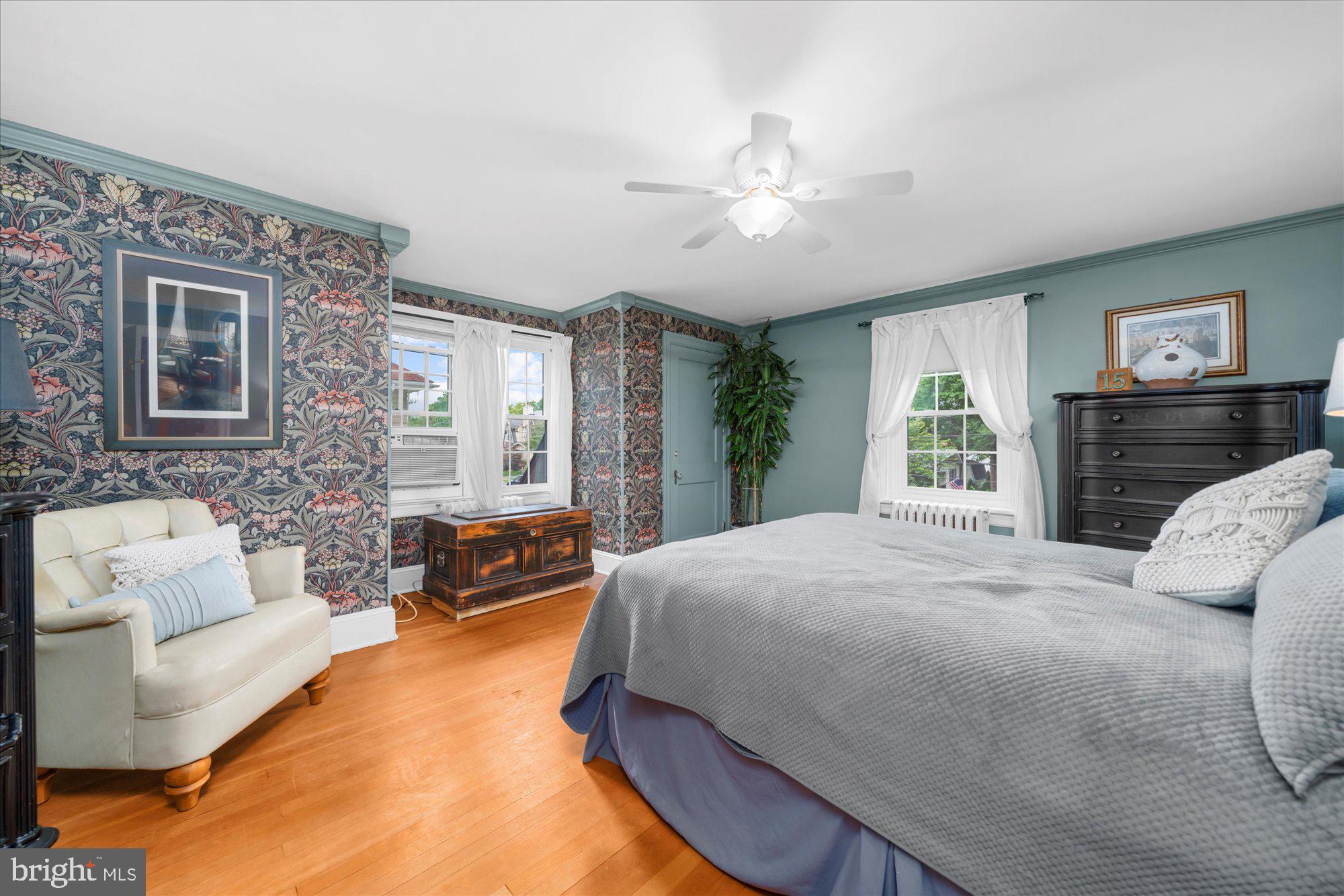 10 North Concord Road West Chester, PA 19382 - Photo 30 of 60 a bedroom with a large bed couch and windows