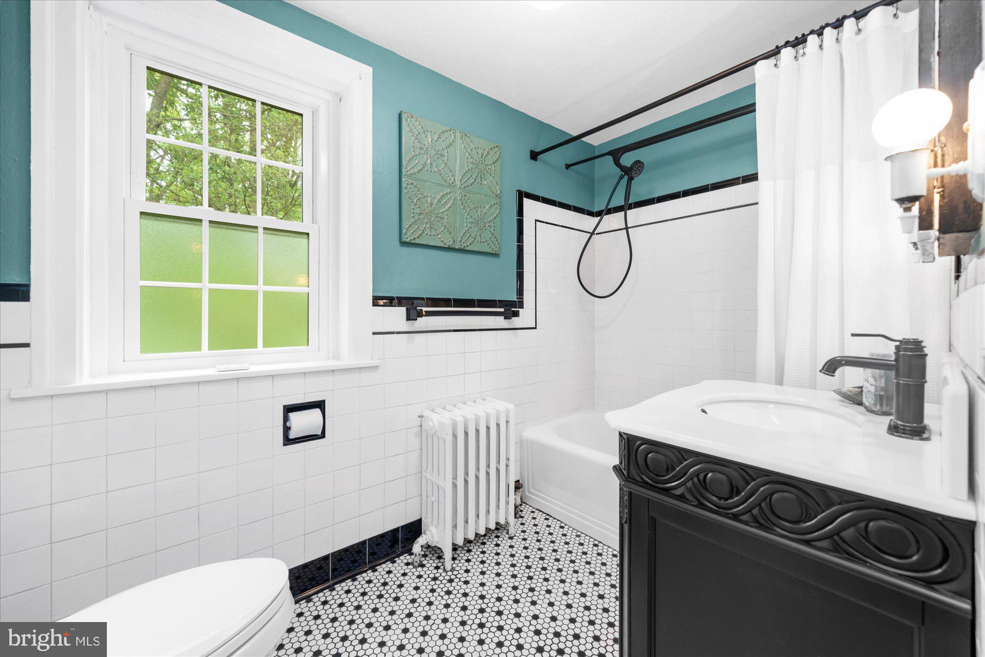 10 North Concord Road West Chester, PA 19382 - Photo 33 of 60 a bathroom with a sink a toilet and shower