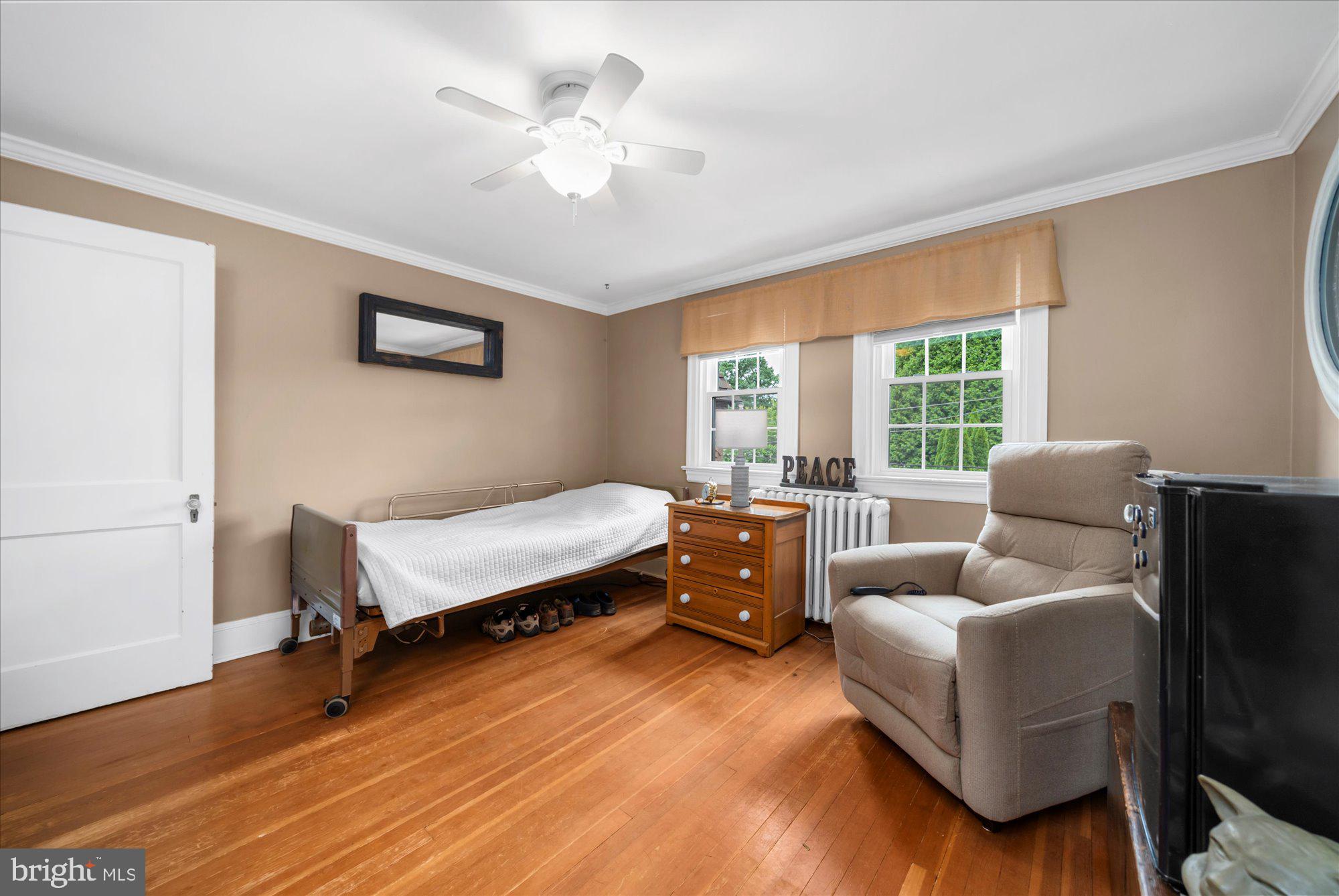 10 North Concord Road West Chester, PA 19382 - Photo 35 of 60 a bedroom with a bed and a couch