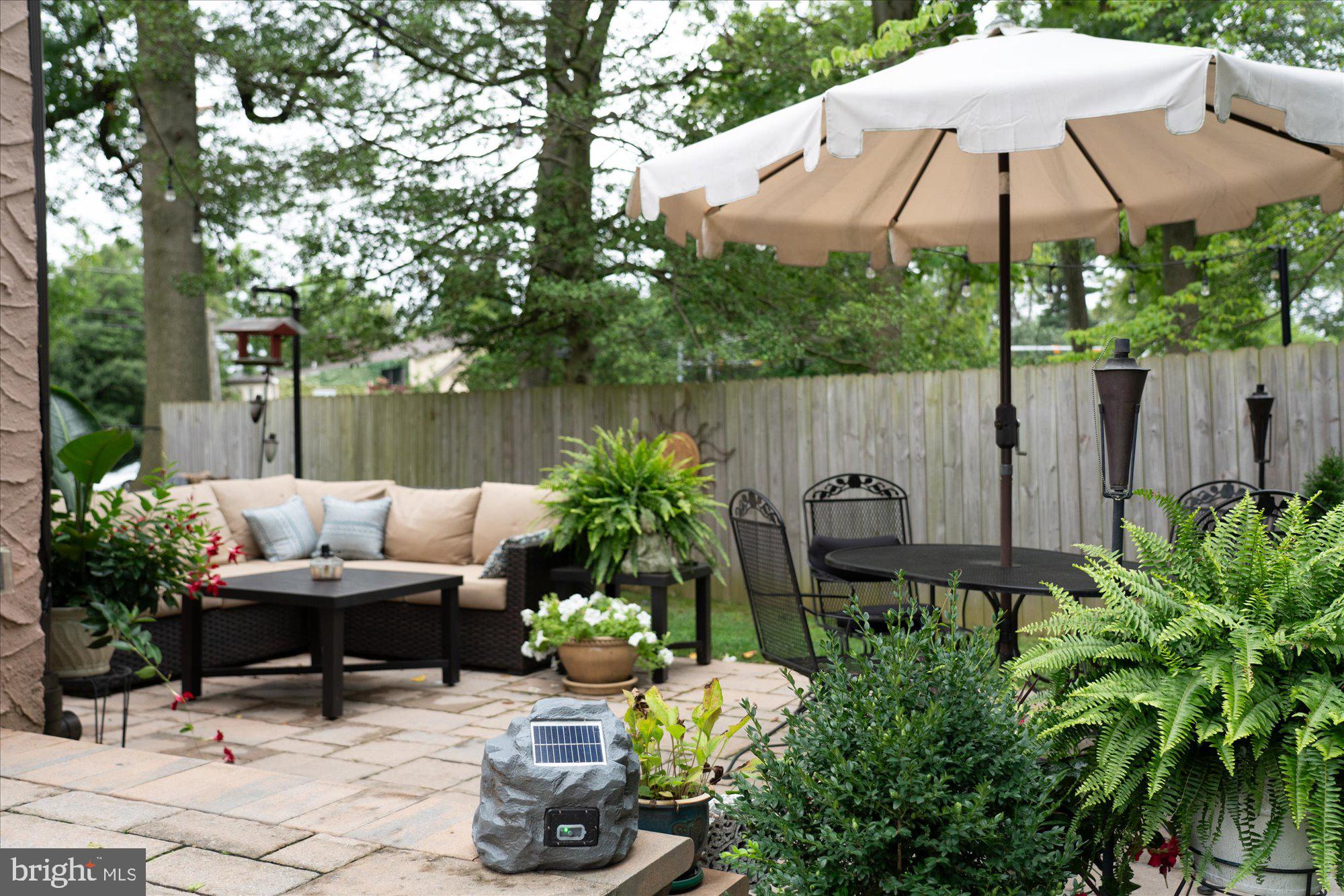 10 North Concord Road West Chester, PA 19382 - Photo 46 of 60 a backyard with plants and outdoor seating