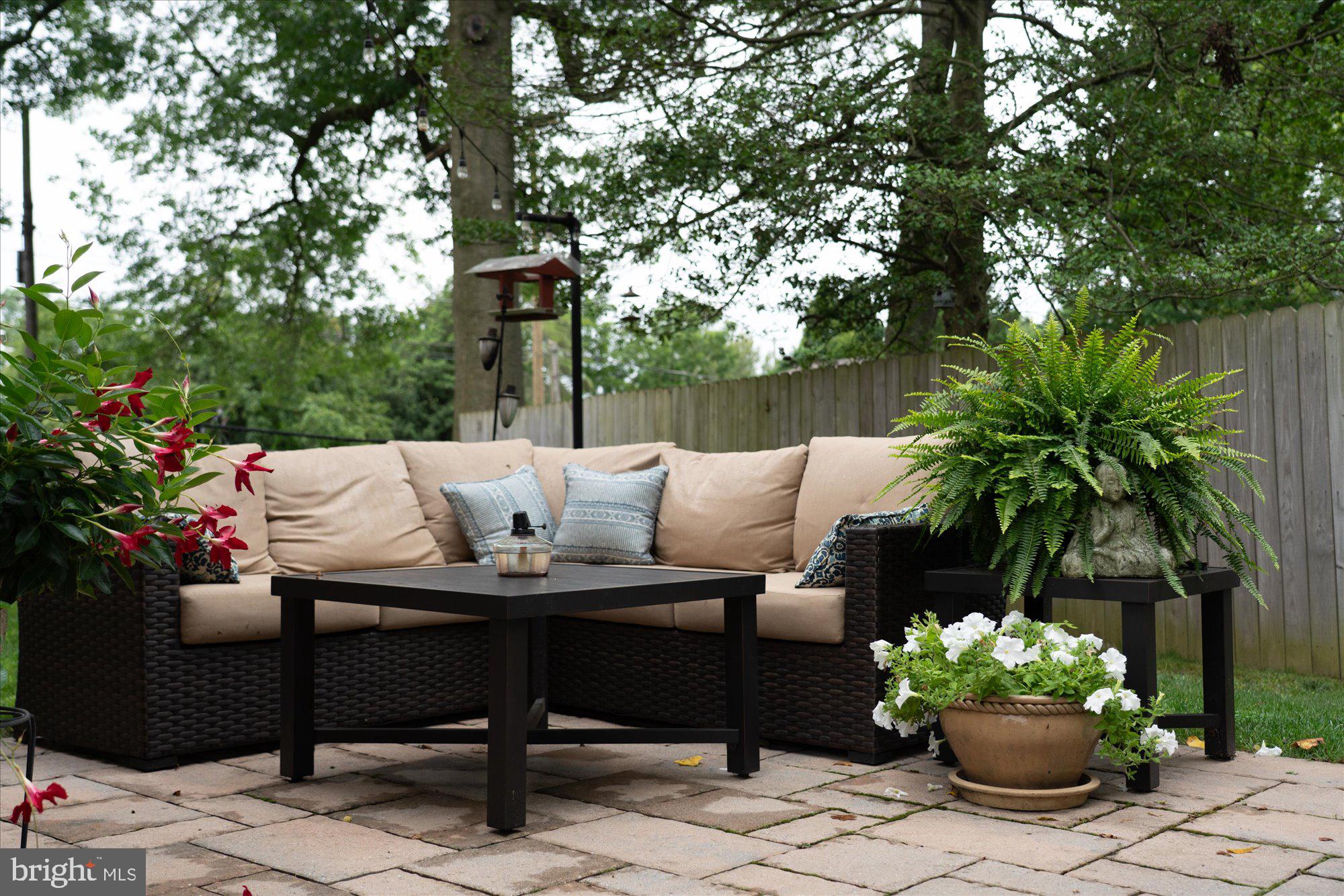 10 North Concord Road West Chester, PA 19382 - Photo 47 of 60 a patio with a table and chairs and potted plants