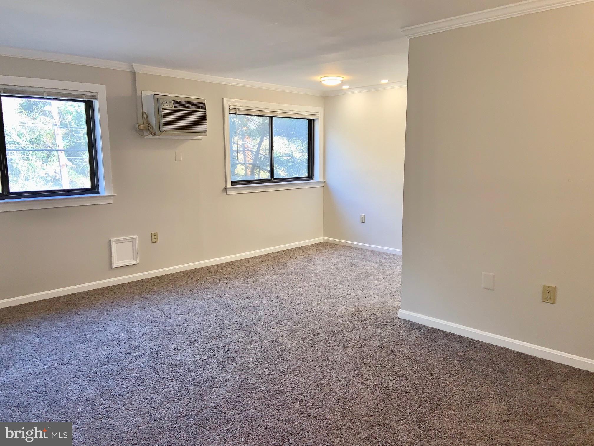 3109 Naylor Road Southeast, Unit 201 Washington, DC 20020 - Photo 14 of 25 Open living room/dining room