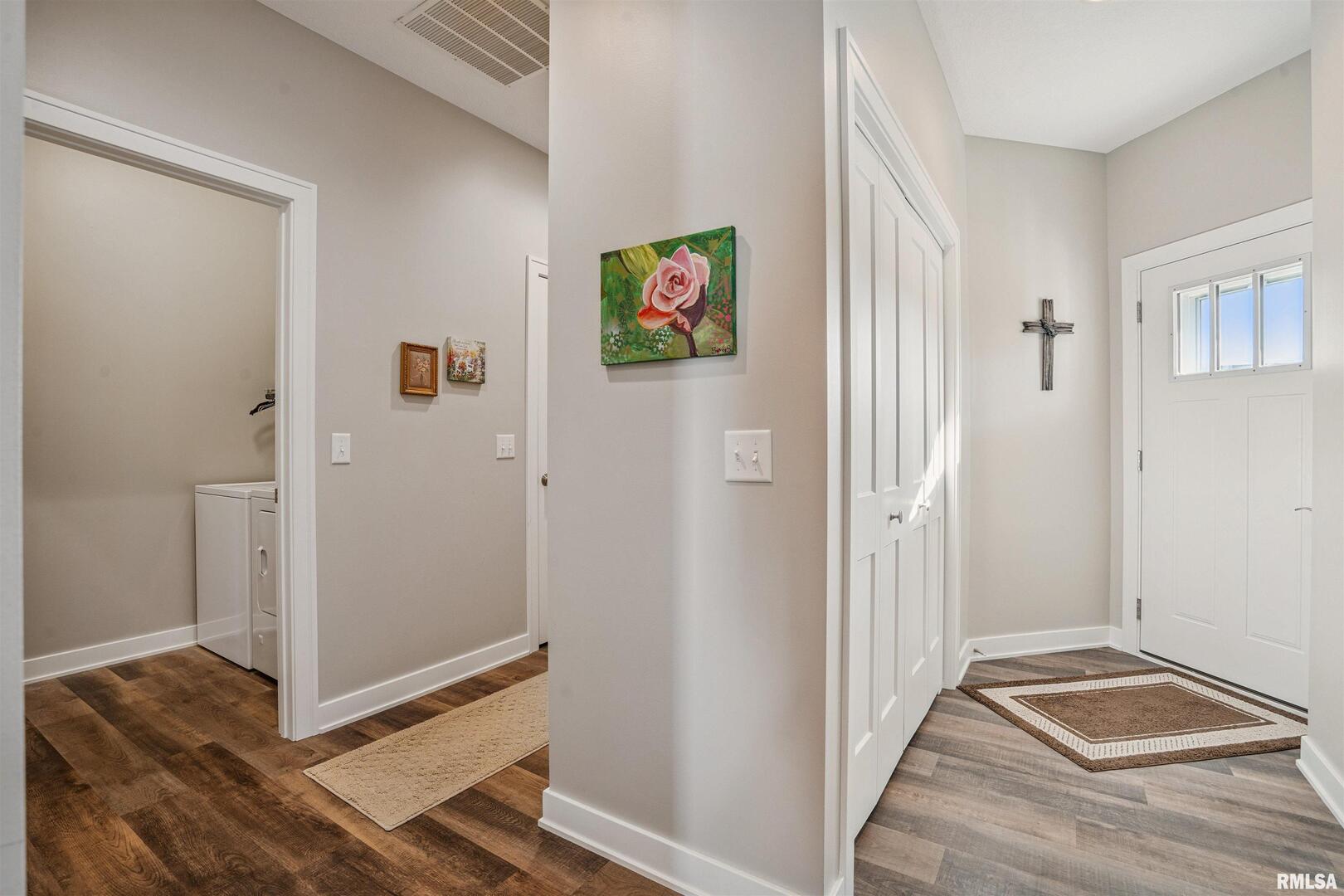 2406 13th Street Silvis, IL 61282 - Photo 3 of 22 a view of a bedroom with wooden floor and bathroom