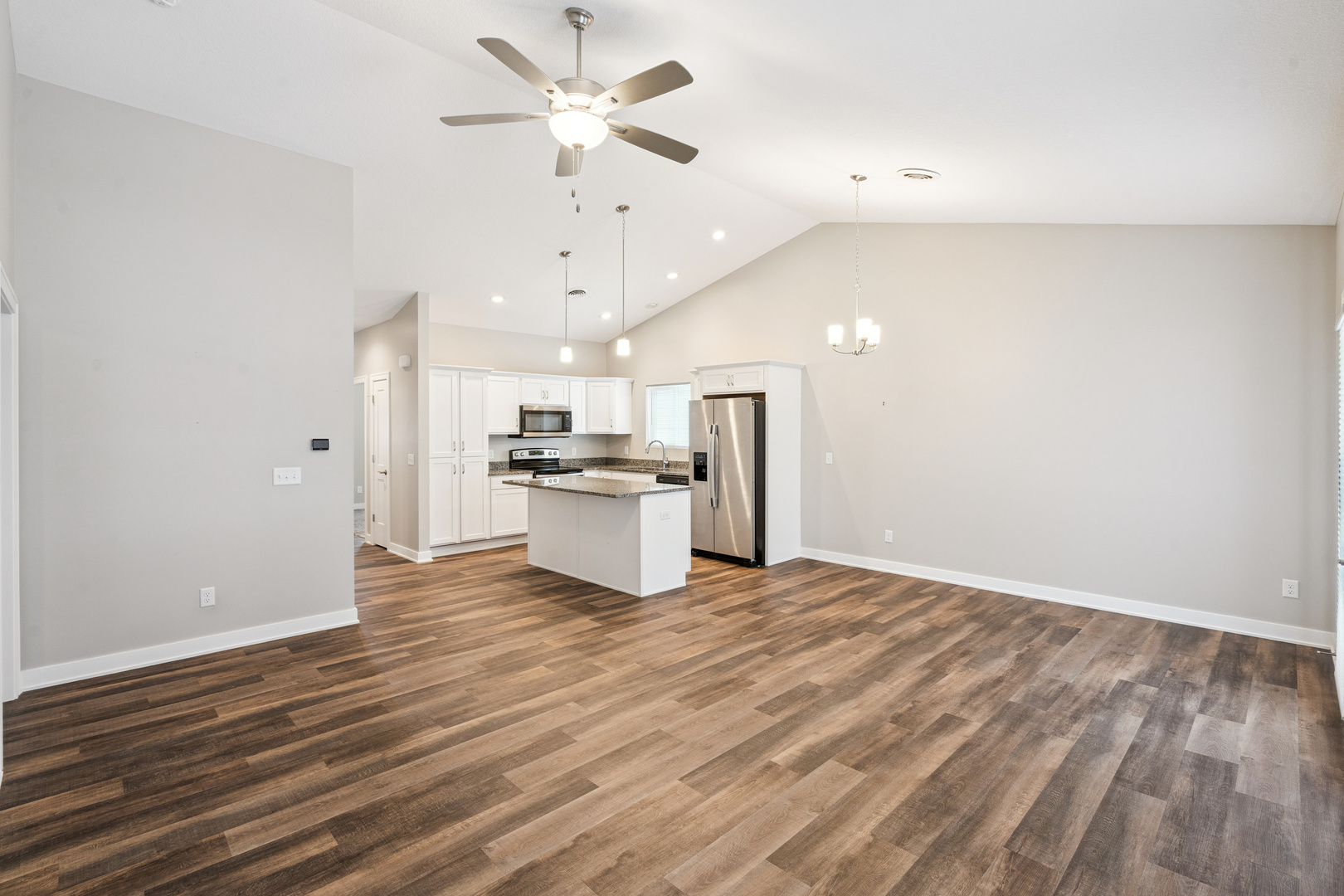 2406 13th Street Silvis, IL 61282 - Photo 10 of 22 a view of kitchen with granite countertop cabinets and refrigerator