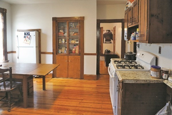 159 Brown Street, Unit 1 Waltham, MA 02453 - Photo 3 of 6 a view of a dining room with furniture and wooden floor